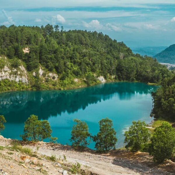 Danau Biru, danau cantik sebiru langit di Desa Penambahan, Kecamatan Talawi, Saw...