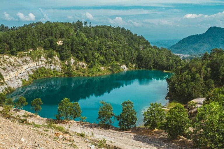 Danau Biru, danau cantik sebiru langit di Desa Penambahan, Kecamatan Talawi, Saw...