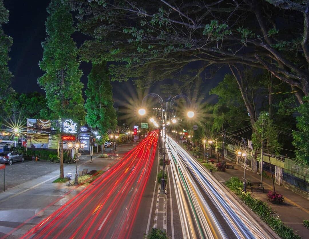 Blazing lights from fast-pacing vehicles on the street of Dago. Make sure to alw...