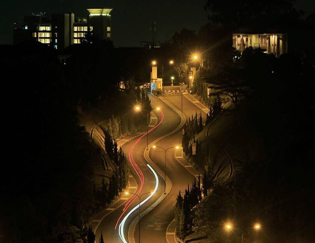 Riding slow in the tranquility in darkness, way up streaking red schemes of the ...
