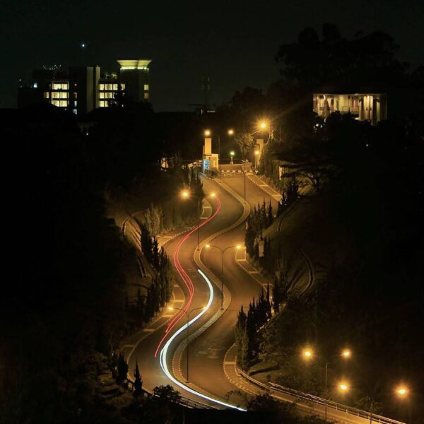 Riding slow in the tranquility in darkness, way up streaking red schemes of the ...