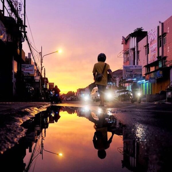 The purple sky, the sunset, and the reflection from the puddle beautifully taken...