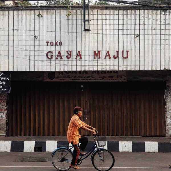 A cyclist passes shopping complex at A. Yani Street. #exploresukabumi photo by ...