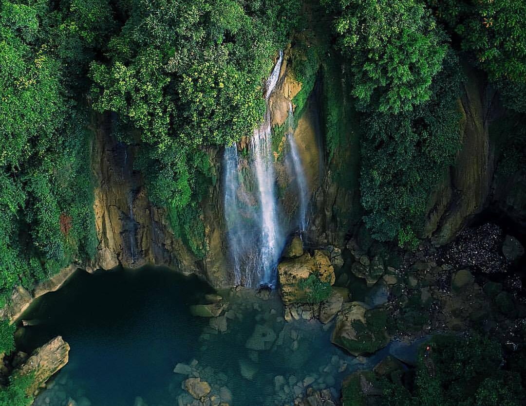 Can you spot a tiny little man? Bird-eye view above Cikaso Fall by  #exploresuka...