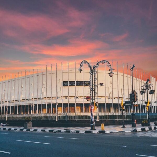 Combination of a vintage historical building of Asia Afrika with a violet sky is...