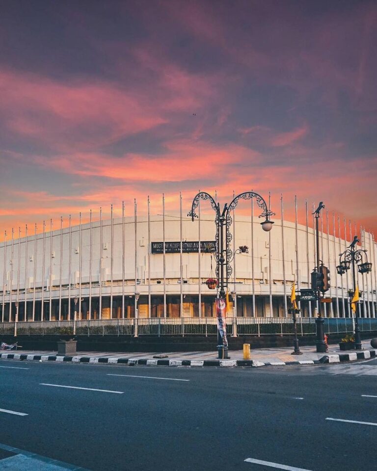 Combination of a vintage historical building of Asia Afrika with a violet sky is...