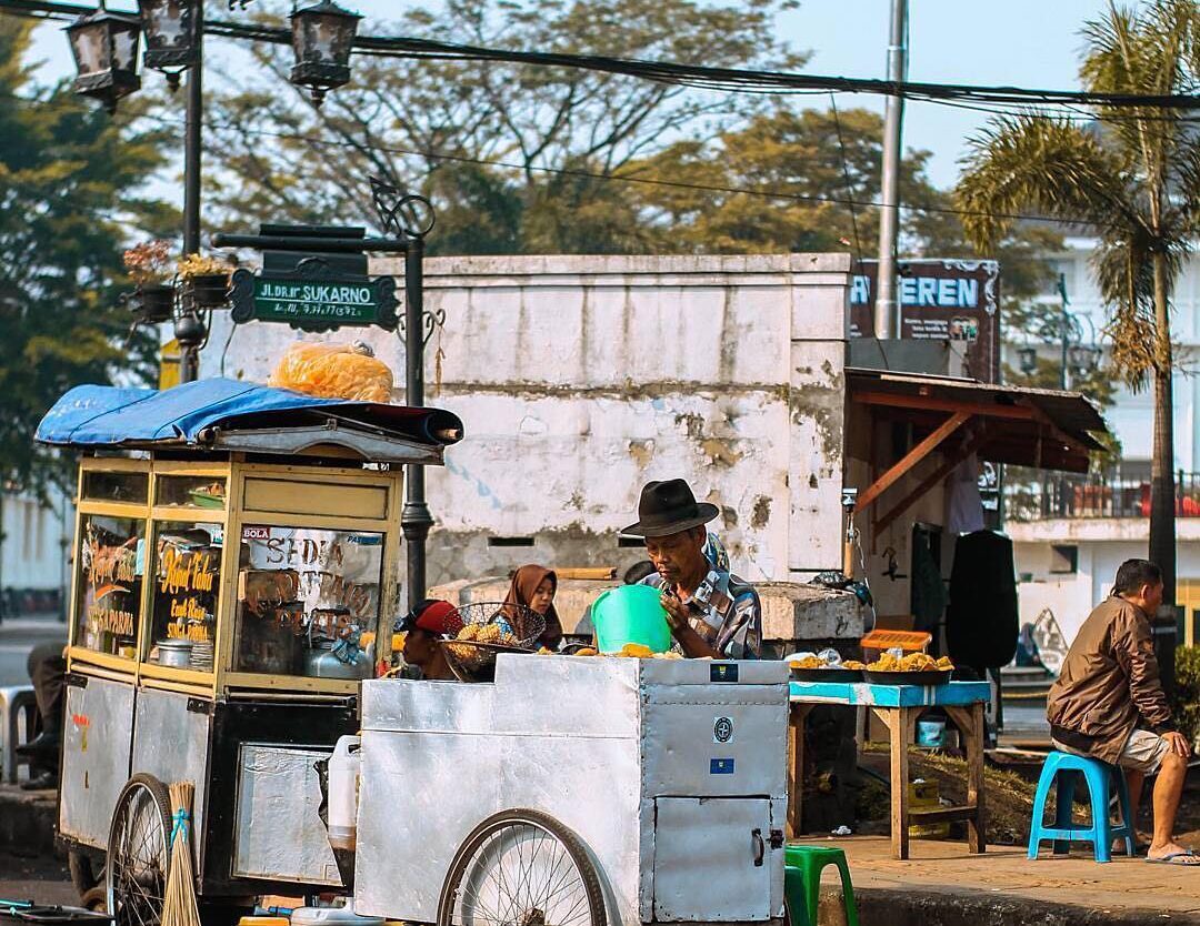 Street food seller on Sukarno Street captured by  What kind of street food is yo...
