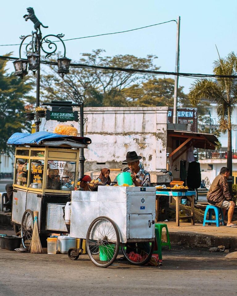 Street food seller on Sukarno Street captured by  What kind of street food is yo...